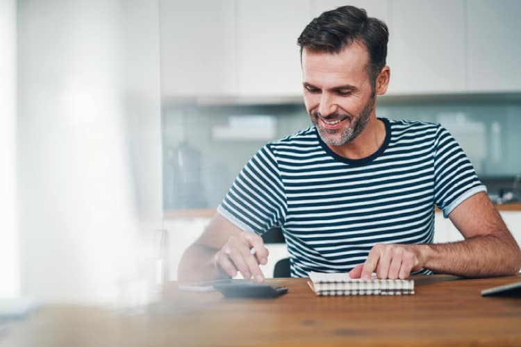 Man Using Calculator