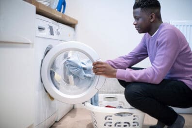 boy doing laundry